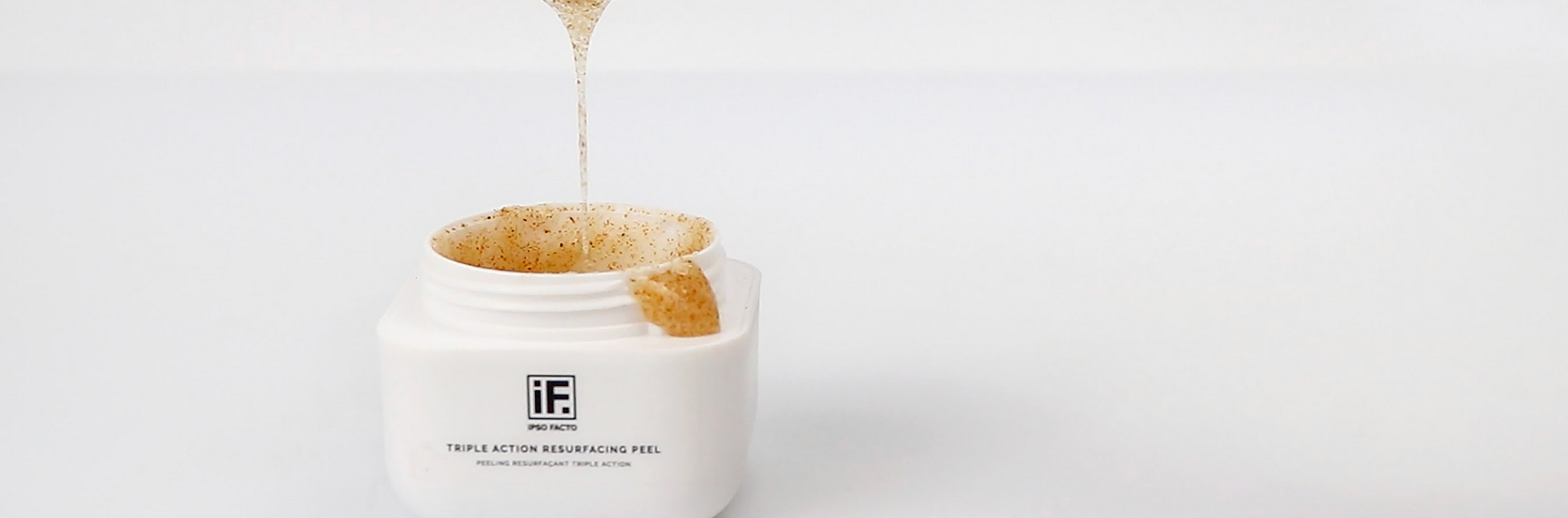 Triple Action Resurfacing Peel exfoliating skincare gel being poured into a white jar