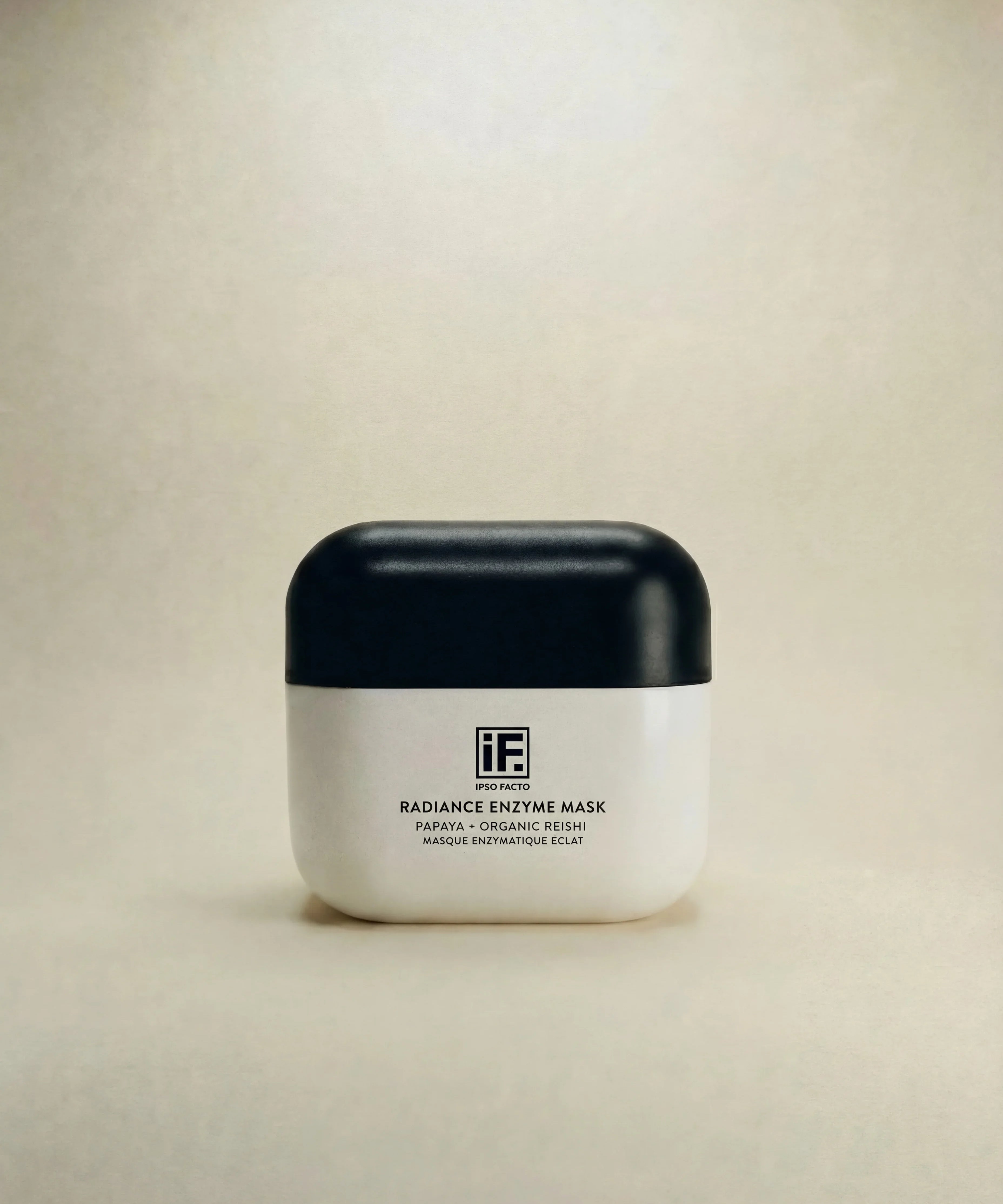 Radiance Enzyme Mask jar with black lid, skincare product for brightening, on neutral background