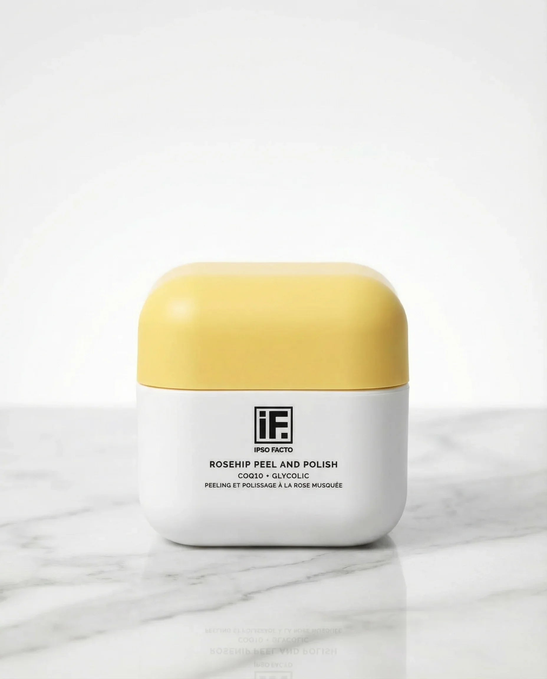 Rosehip Peel and Polish skincare jar with yellow lid on marble surface