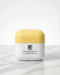 Rosehip Peel and Polish skincare jar with yellow lid on marble surface