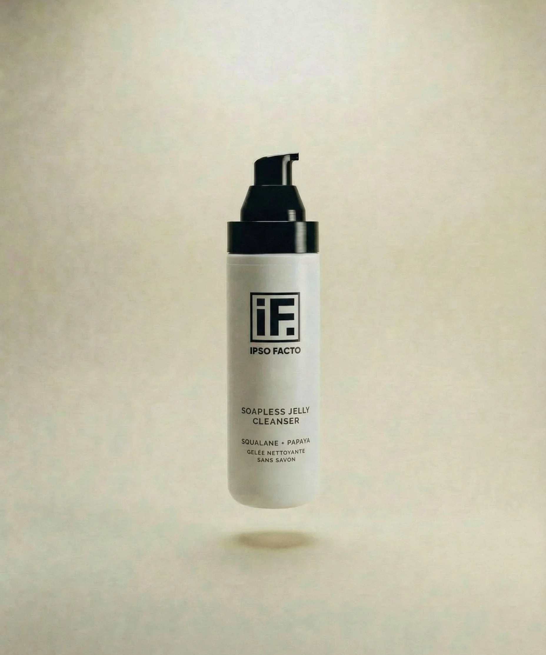 Soapless jelly cleanser bottle with pump, squalane and papaya formula on neutral background