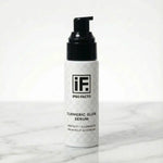 Turmeric Glow Serum skincare bottle with pump on white marble background