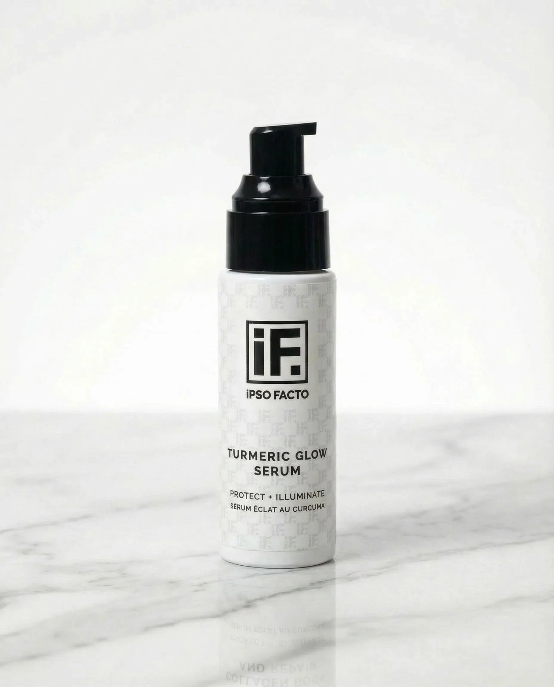 Turmeric Glow Serum skincare bottle with pump on white marble background