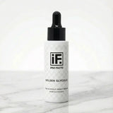 10% glycolic night serum bottle with dropper on white marble background