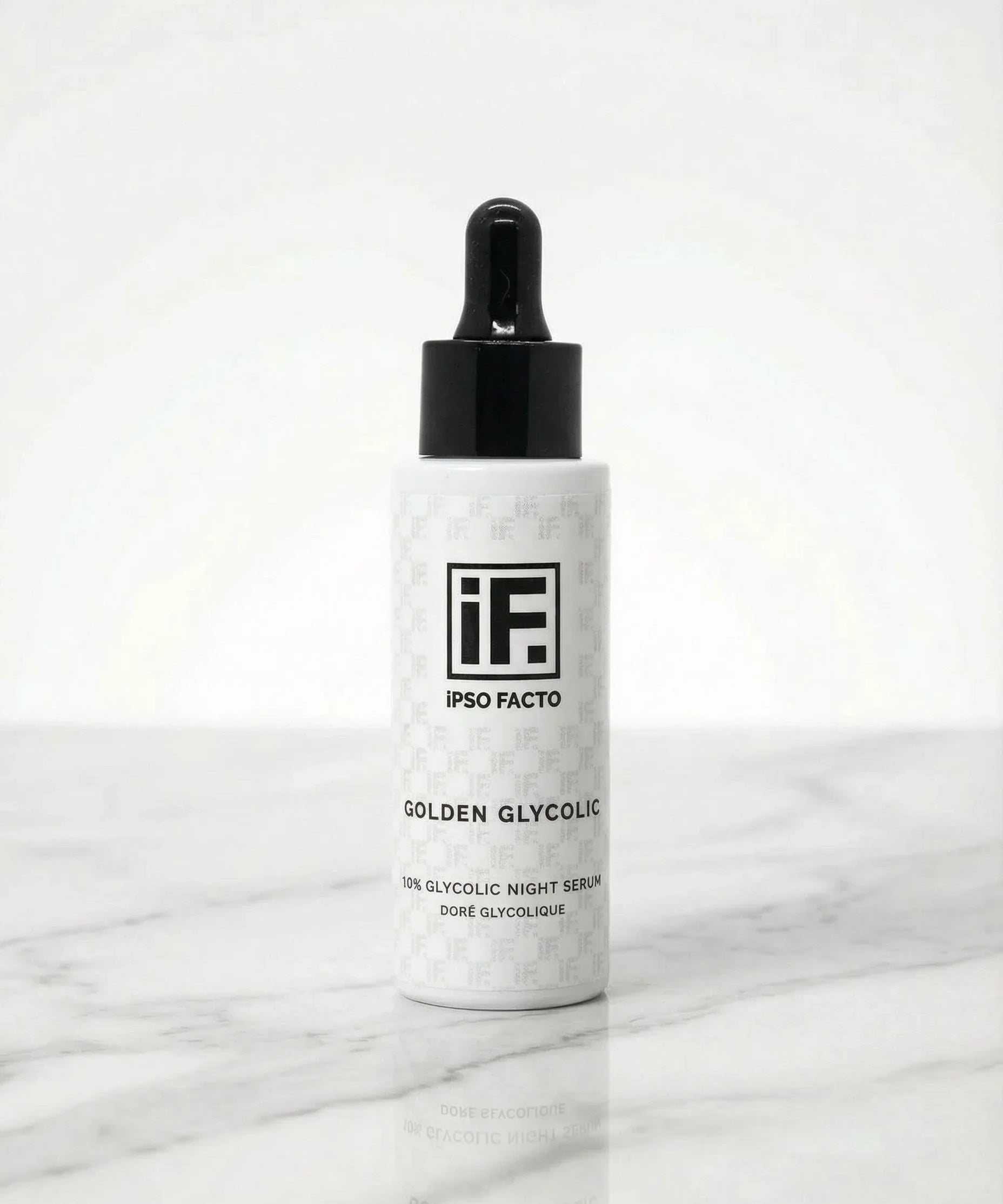 10% glycolic night serum bottle with dropper on white marble background