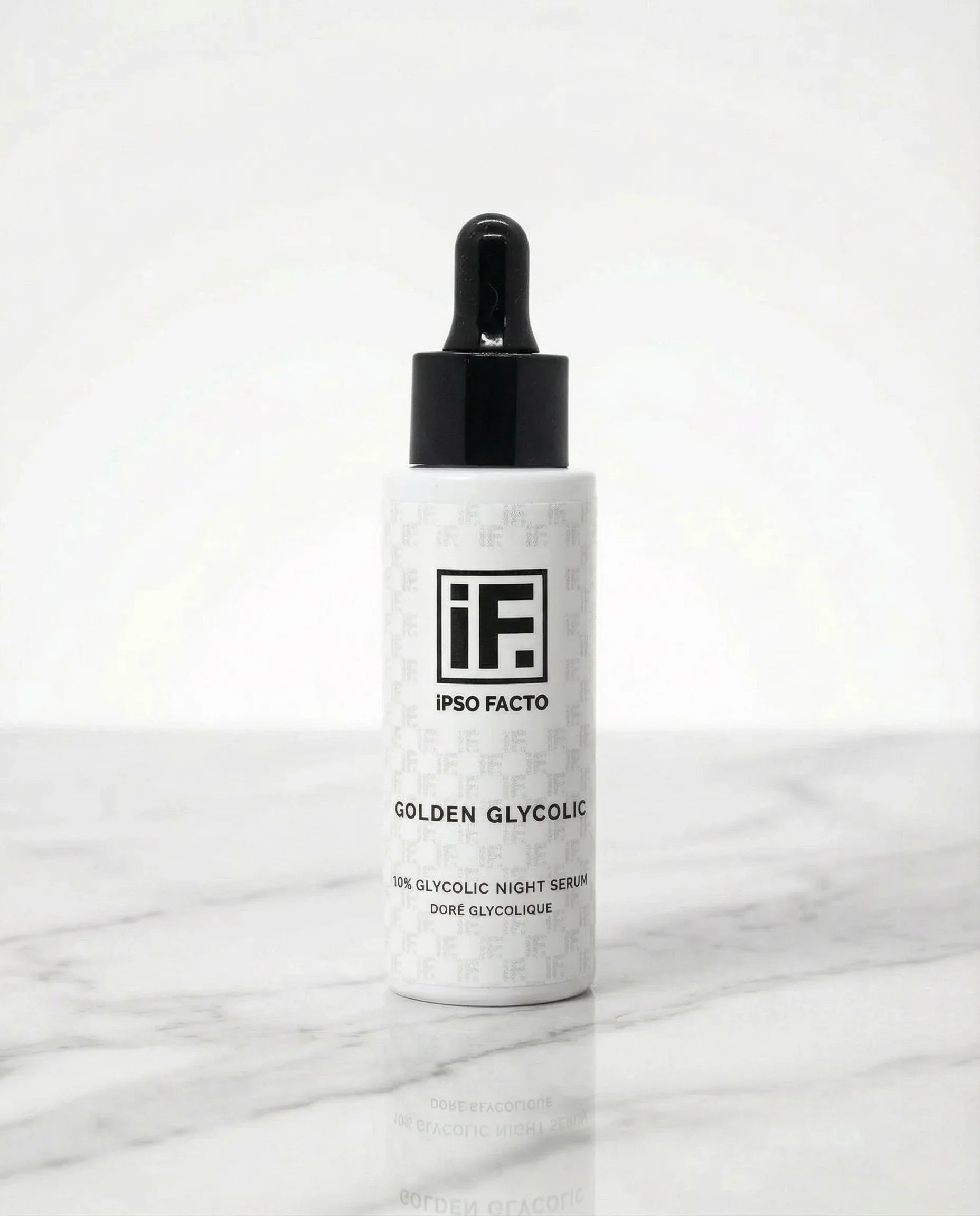 10% glycolic night serum bottle with dropper on white marble background